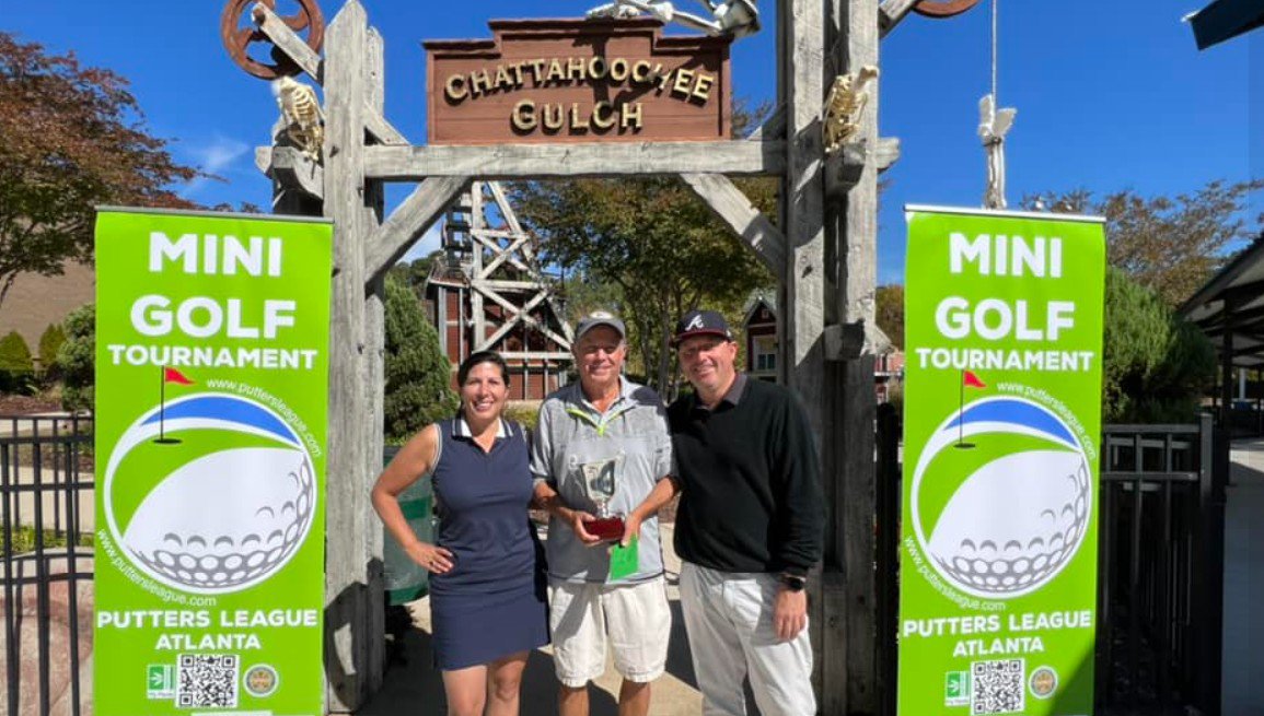 Sports fans winning a mini golf tournament