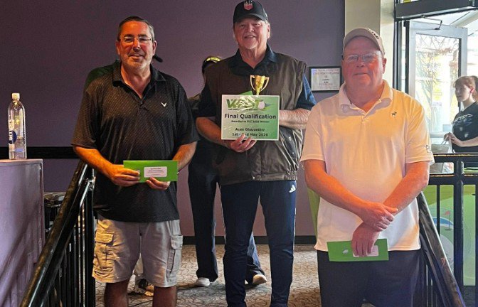 Competitive players holding awards at a mini golf qualifier
