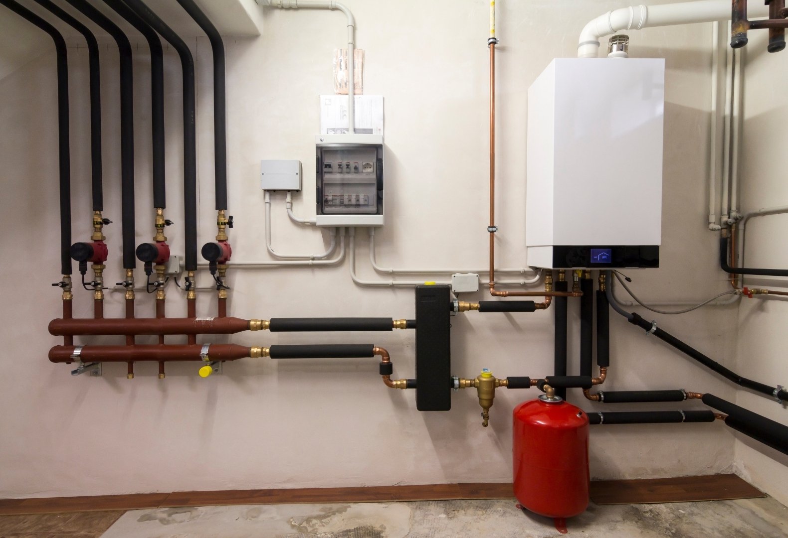 Well-maintained pipes inside a boiler room. Well-maintained pipes inside a boiler room.