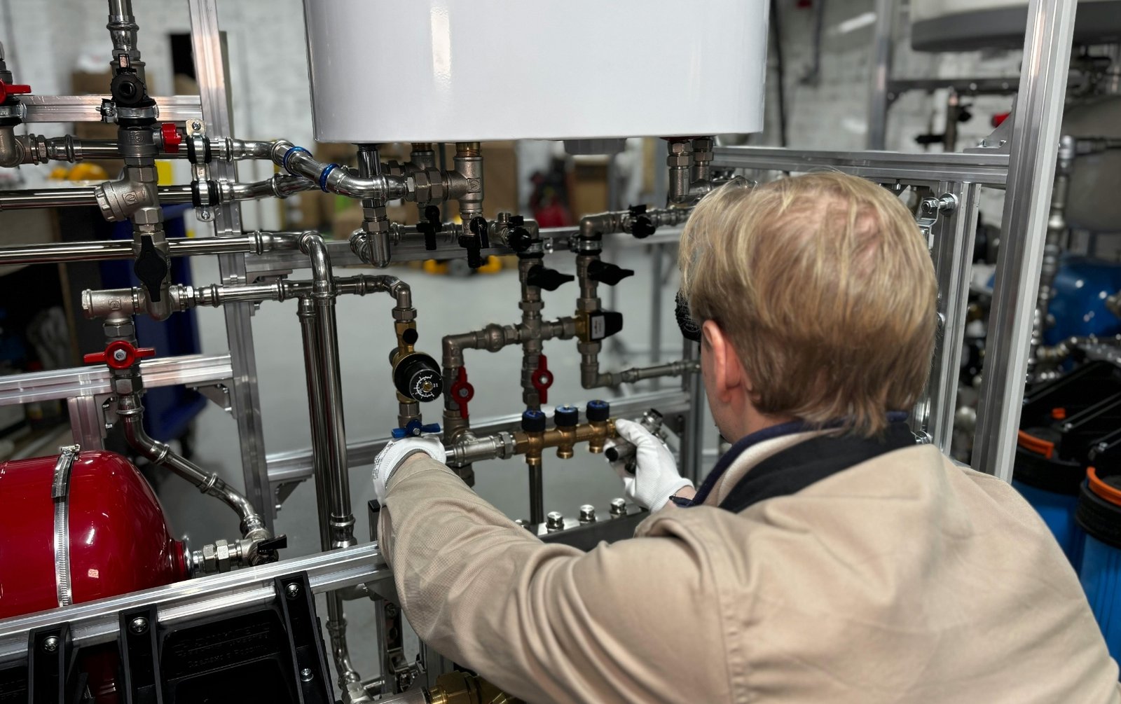 Boiler maintenance engineer looking for steam leaks.