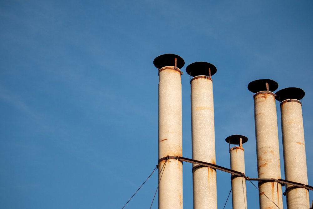 Industrial chimney heating pipes of a large facility.