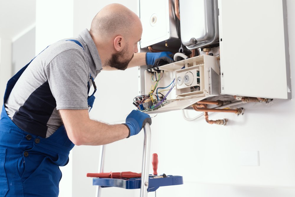 Technician performing a boiler upgrade.