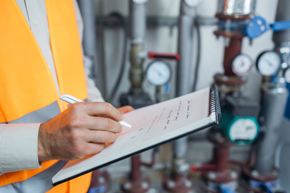 Engineer scheduling an inspection regarding boiler upgrades.