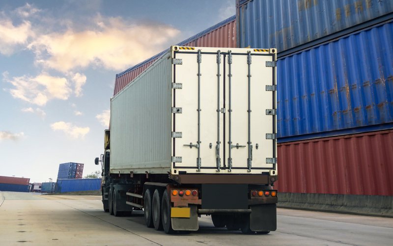 Container white truck in cargo port