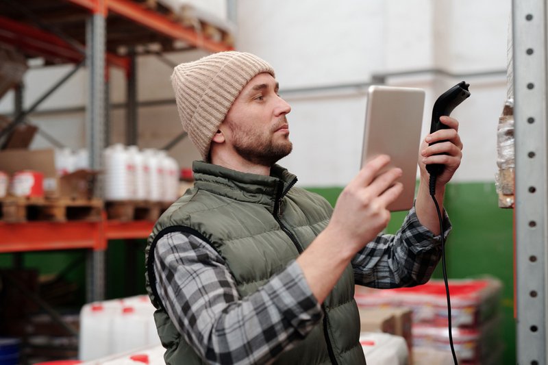 Employee using tablet to check inventory