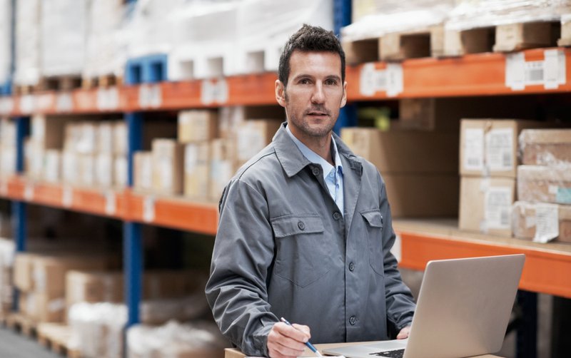 Warehouse manager using computer to manage procurement automation
