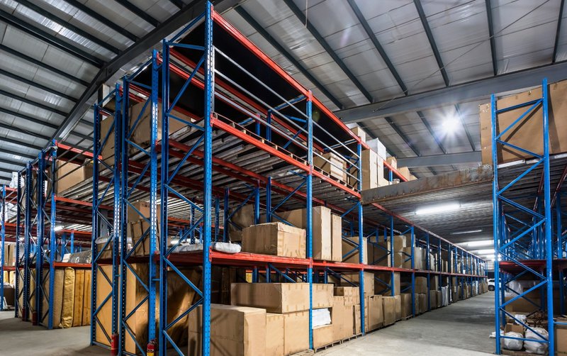 Shipping warehouse filled with shelves and cargo