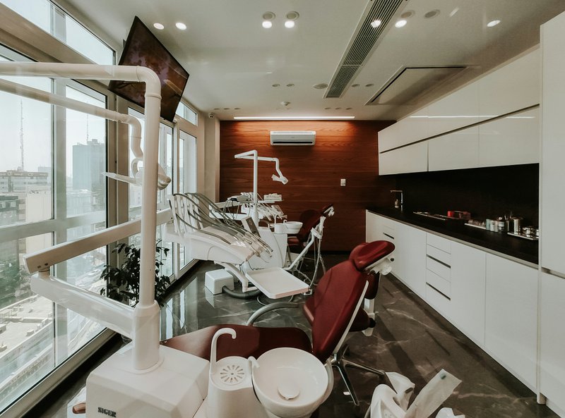 A dental practice with empty chairs.
