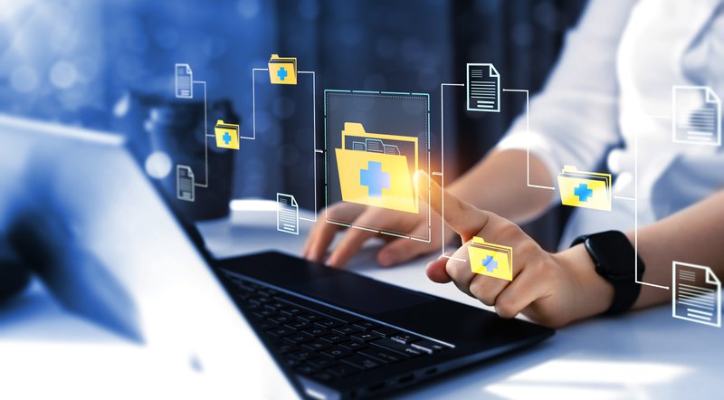 A computer with a person typing and following cybersecurity best practices.