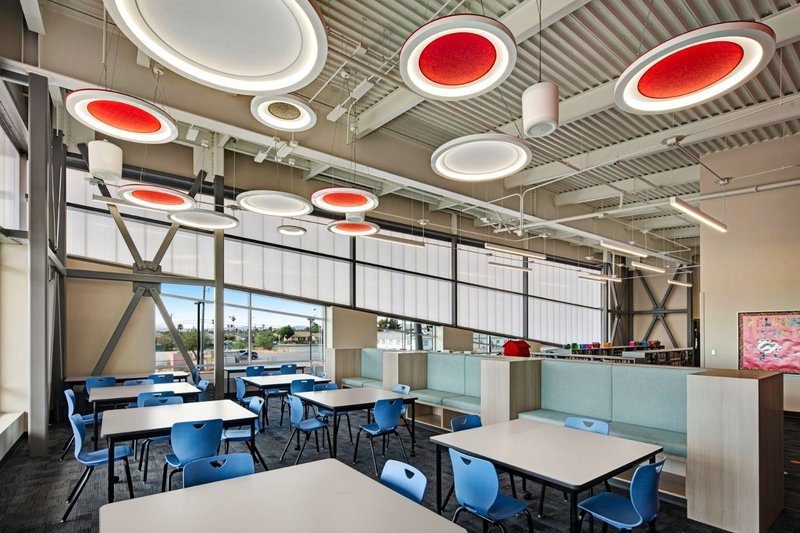 A modern classroom interior showing a clean, structured Wall Facade.