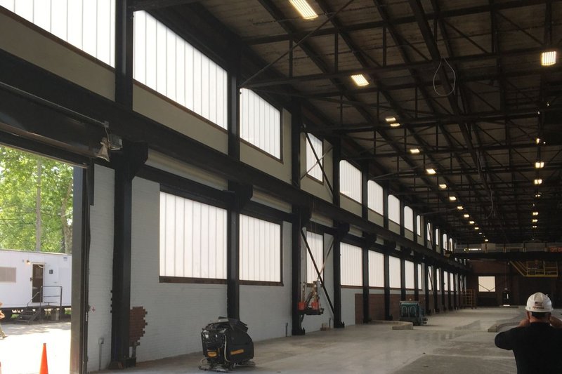 An industrial facility interior naturally illuminated by impact-resistant Warehouse Windows.