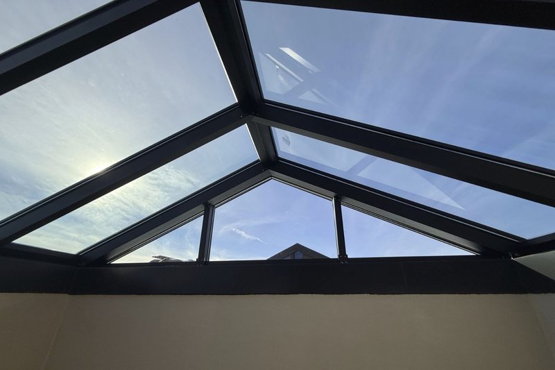 An upward view of a modern roof lantern highlighting advanced Types of Skylight.