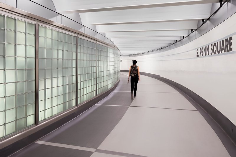 An interior glass block screenwall at a SEPTA facility featuring a Polycarbonate Canopy system.