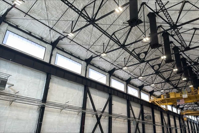 Interior view of an industrial building featuring windows with Polycarbonate Glazing.