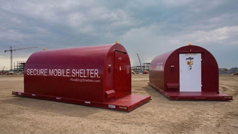 Red Dog mobile shelters stationed on a construction site for Severe Weather Risk Management.