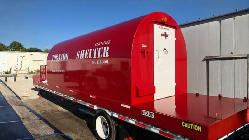 A mobile tornado shelter safe room mounted on a trailer, supporting Emergency Management for Data Centers.