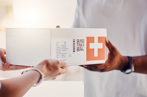 a box of pharmaceutical items with barcodes and QR code for traceability