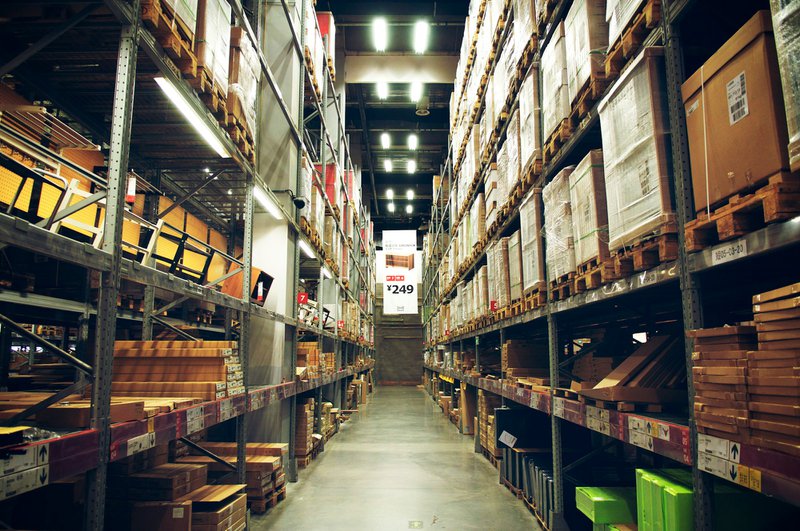 a warehouse wiith rows of boxed items