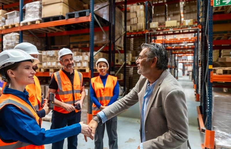 finance team head meeting with the warehouse staff after automated handling planning