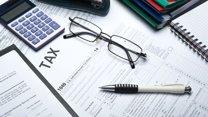 Tax documents and a calculator layout used to estimate the useful life of assets.