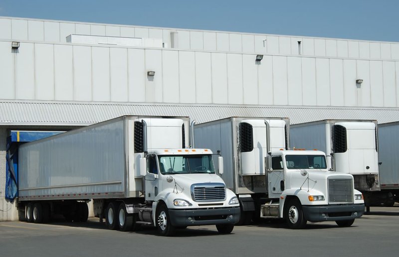 trucks docking in a cross-dock facility