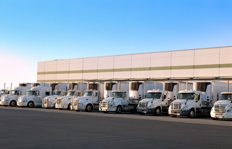 loaded trucks getting ready for distribution