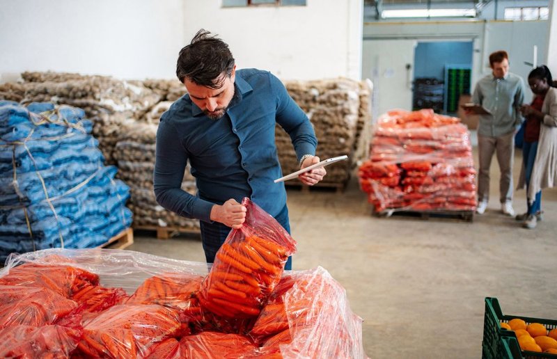 AIB-certified warehouse manager checking sausages for export