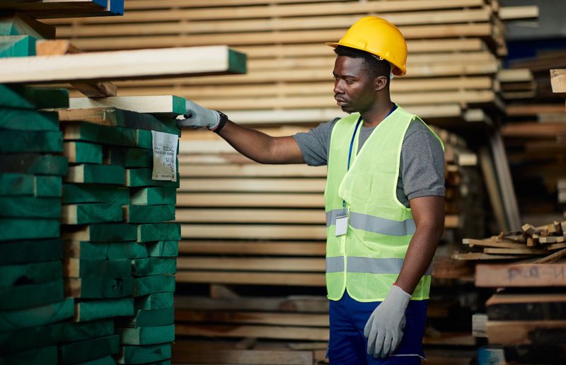 warehouse staff checking lumber
