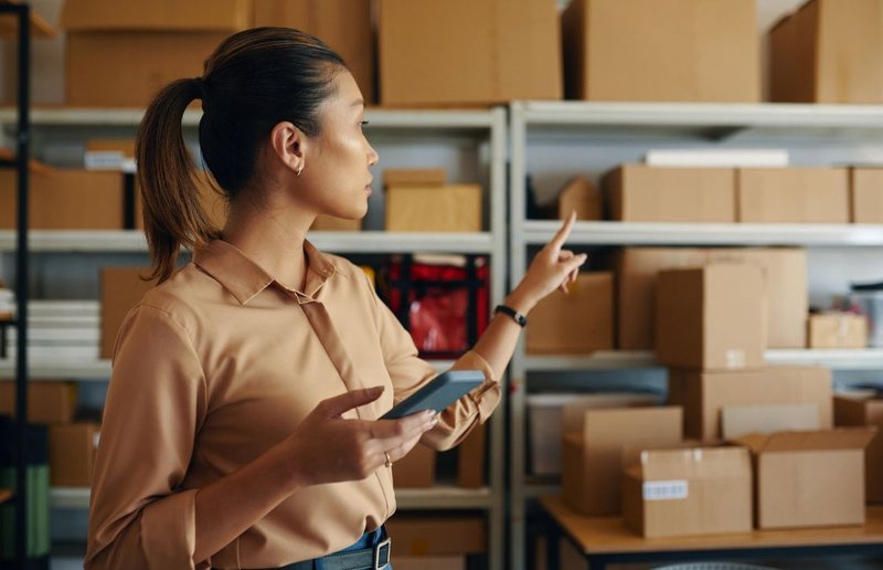 warehouse manager checking each parcel to avoid mis-shipment