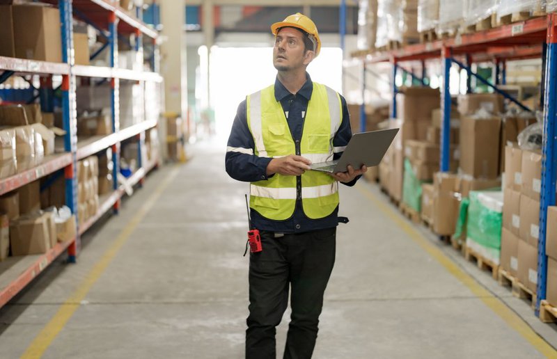 warehouse supervisor checking inventory using ERP warehouse management system