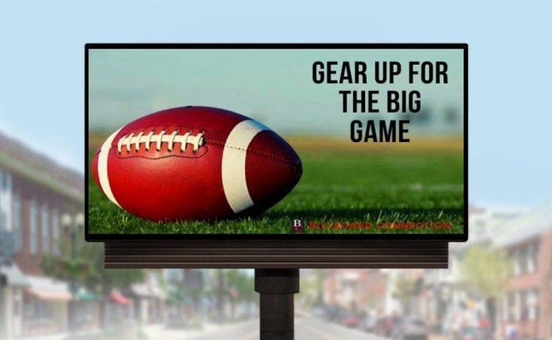 Billboard advertising display along a busy road building public brand visibility.