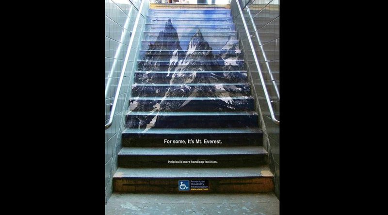 A staircase outdoor ad using mountain imagery to highlight accessibility challenges.