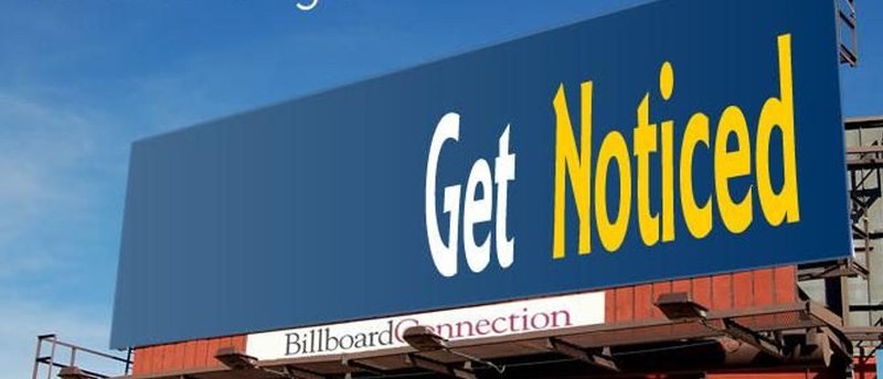 a billboard rental on the side of a highway