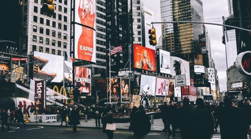 Multiple billboard displays in a busy urban market showing the range of placements evaluated through billboard location analytics.