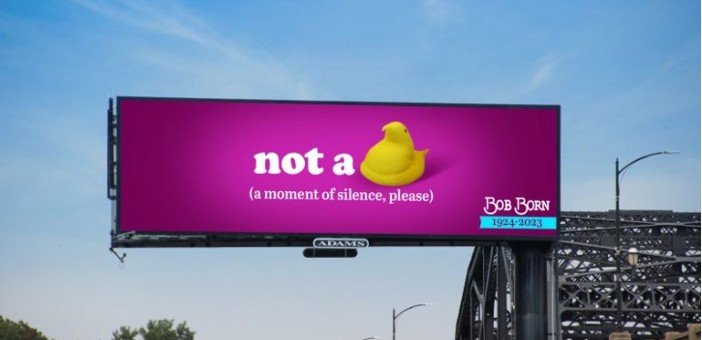 A bright pink roadside billboard with a bold creative message, representing OOH for lead generation through memorable outdoor ads
