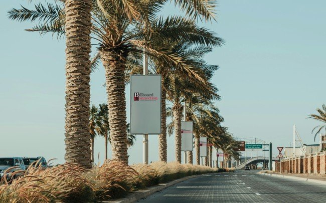 Roadside banner placements illustrating outdoor advertising for startups along a high-visibility boulevard