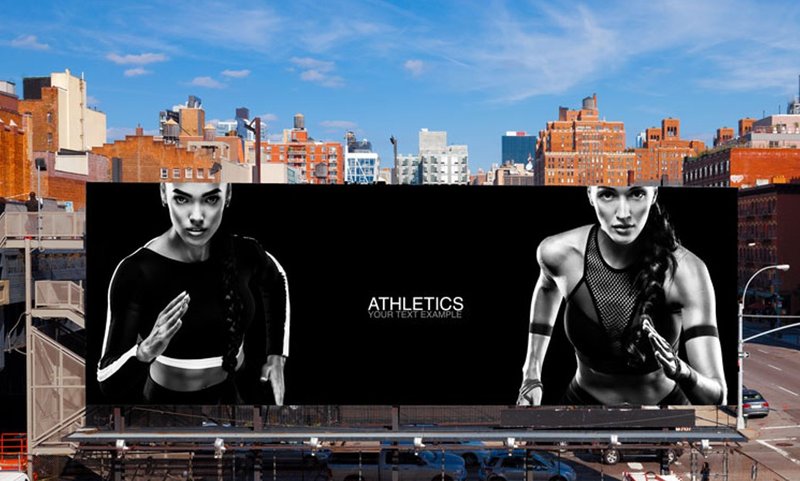 An airport-area billboard with two women athletes near Hartsfield-Jackson serving travelers and local traffic