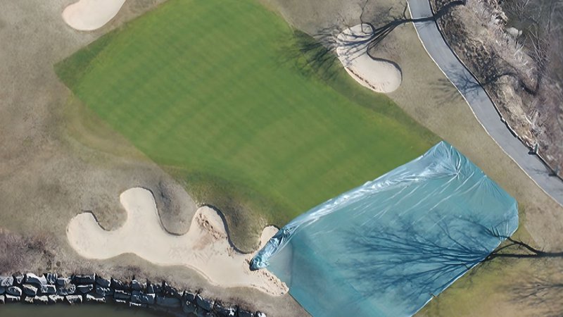 protective turf covers protecting golf green during late autumn