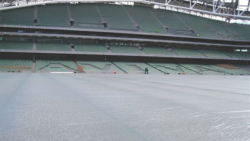 football pitch covers spread out on a field