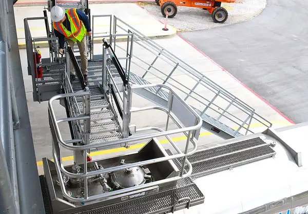 This photo features a portable gangway being set up for use