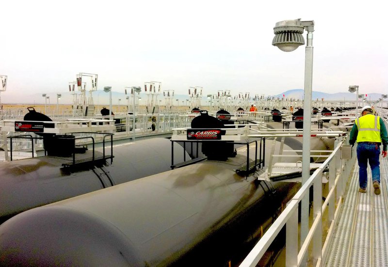 This photo features railcars in an industrial complex 