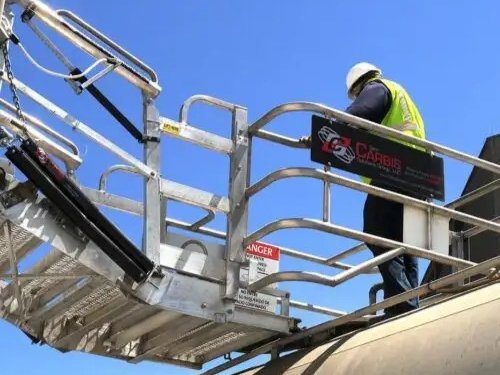 A worker on a loading platform secured with position switches