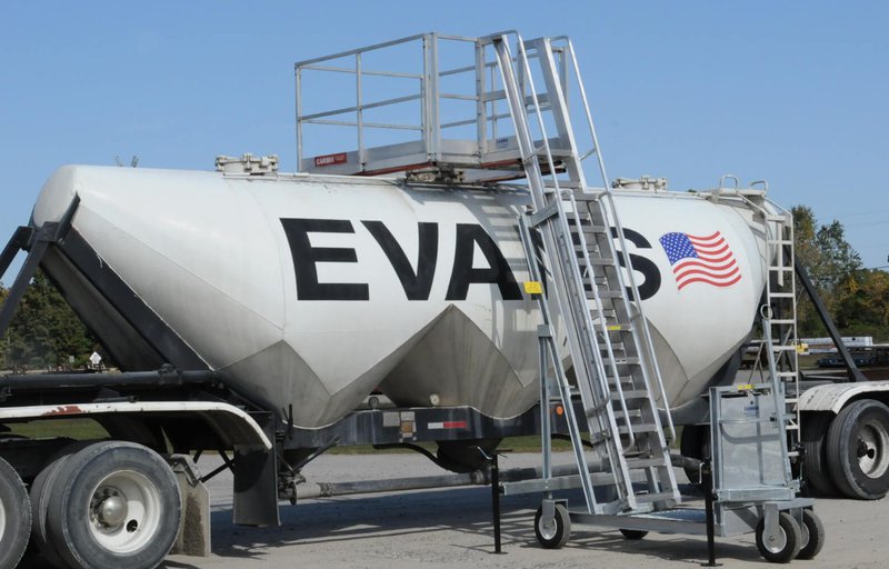 A portable access platforms is placed on a huge truck.