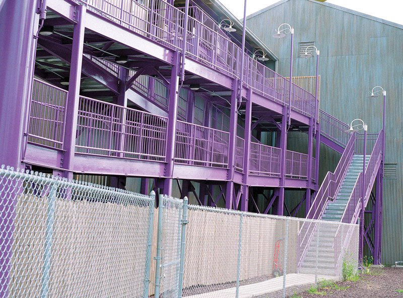 A purple stair tower at a facility