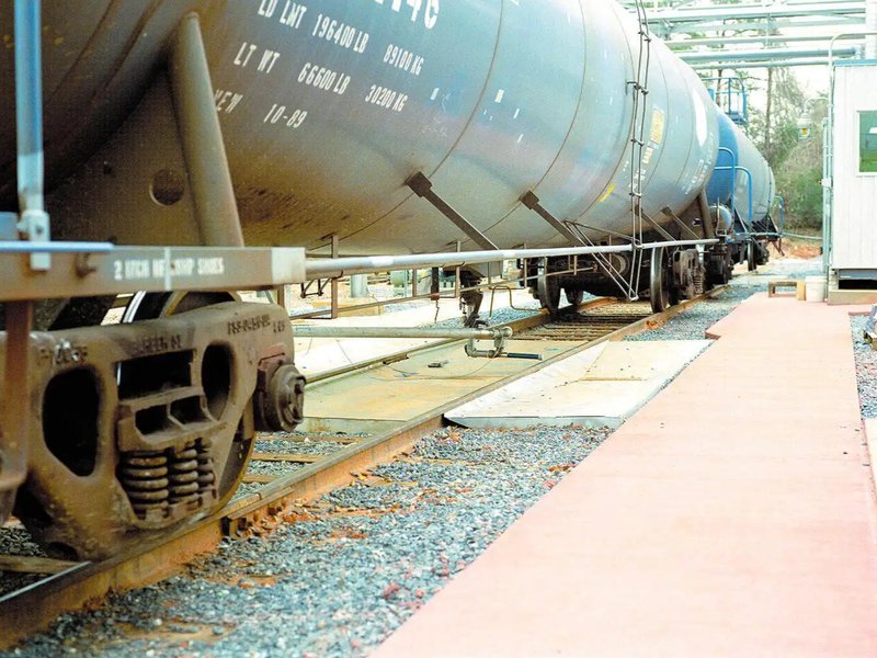 A railcar with a spill containment system
