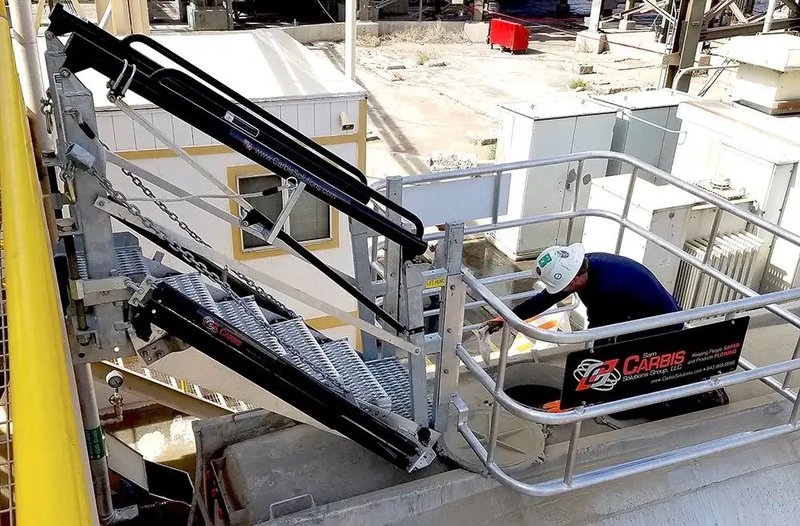 This photo features a worker on a custom loading system