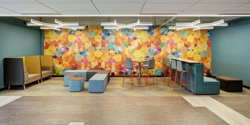This photo displays an ergonomic collaborative space that carries the brand's aesthetic