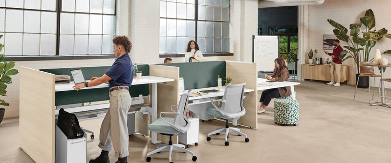 The image shows an office space using open line commercial furniture