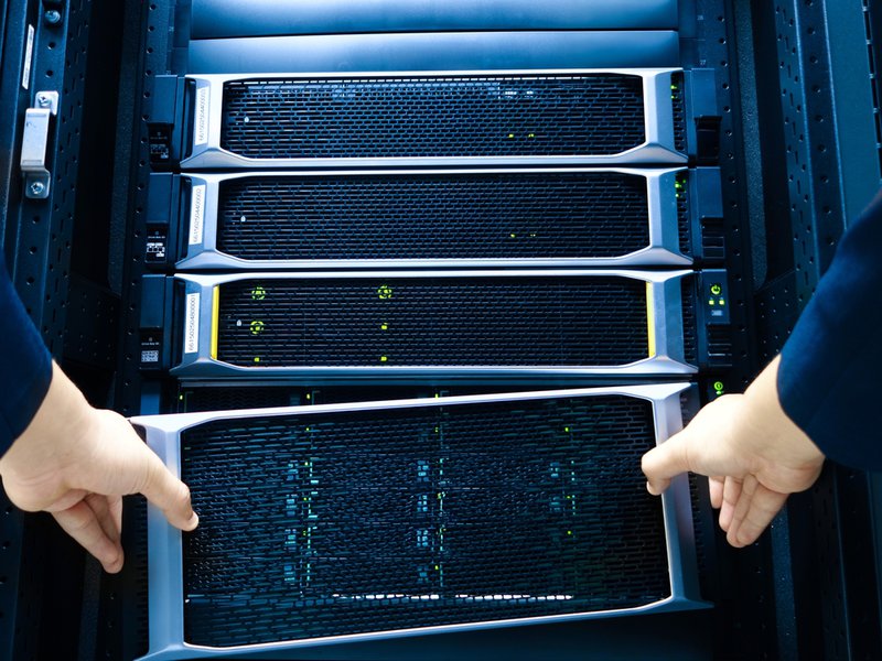 Cleanroom airlock entry into an ISO-class controlled data center environment with personnel gowning and environmental monitoring systems at access point.