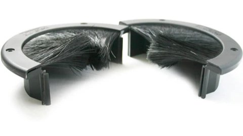 Raised floor cable seal covering an opening to block airflow leakage and improve cooling efficiency.